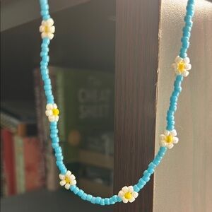 Blue Beaded Necklace with Daisy Accents